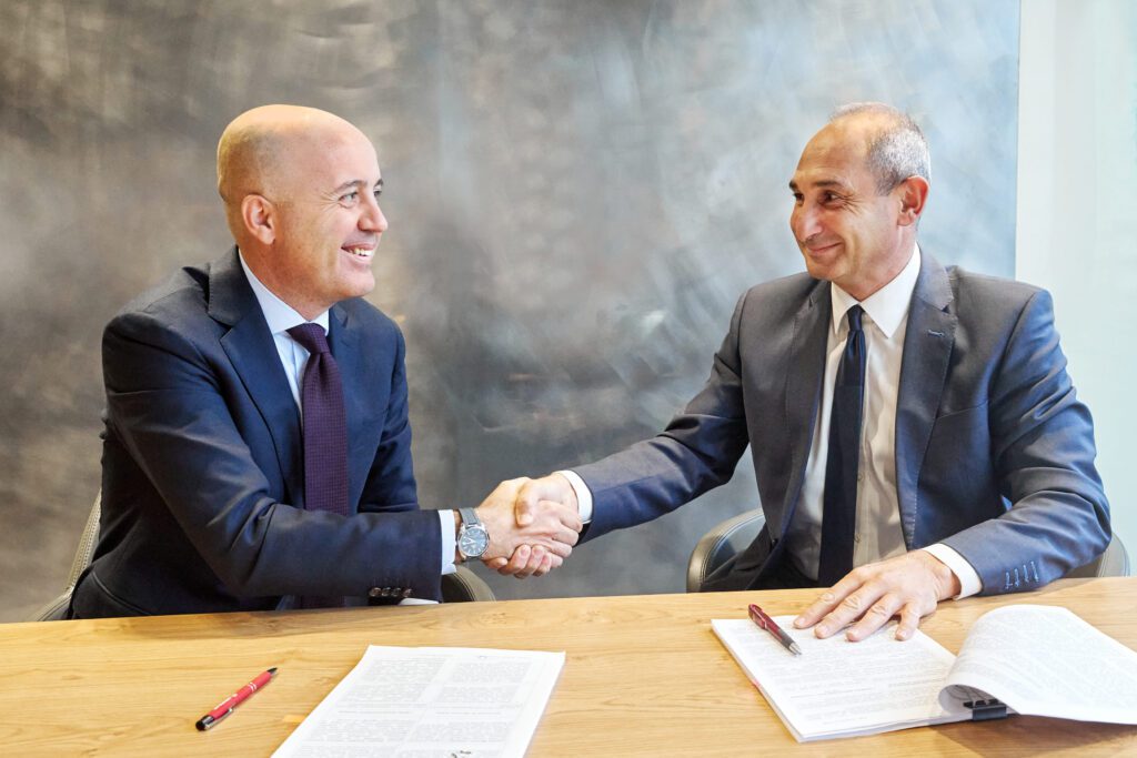  Abdullah Koksal (left) and Kirill Rechter (right) shake hands after signing the cooperation agreement